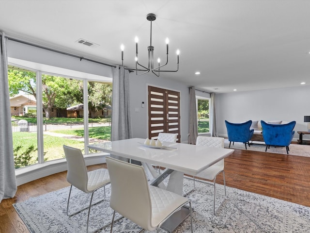 7724 Meadowhaven Dr, Dallas, TX 75254 - dining area featuring a chandelier, wood finished floors, and recessed lighting