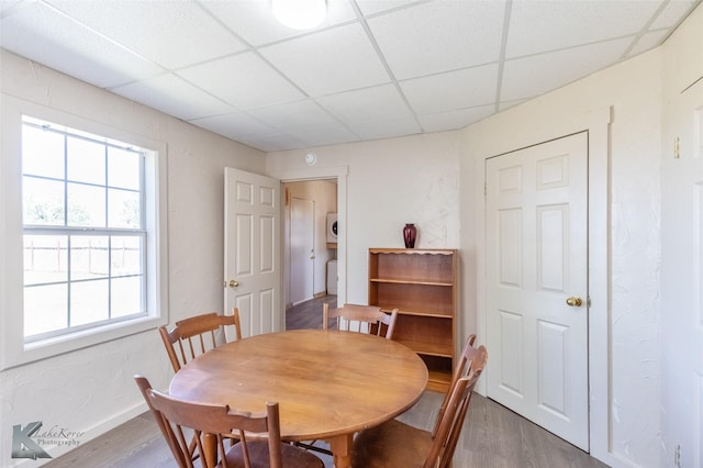 240 5th St, Hawley, TX 79525 - dining area with a drop ceiling, wood finished floors, and baseboards