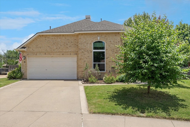 8408 Island Ct, Fort Worth, TX 76137 - view of front of property featuring brick siding, concrete driveway, a front yard, and a garage