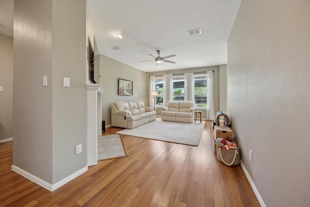 8408 Island Ct, Fort Worth, TX 76137 - living area featuring wood finished floors, ceiling fan, and baseboards