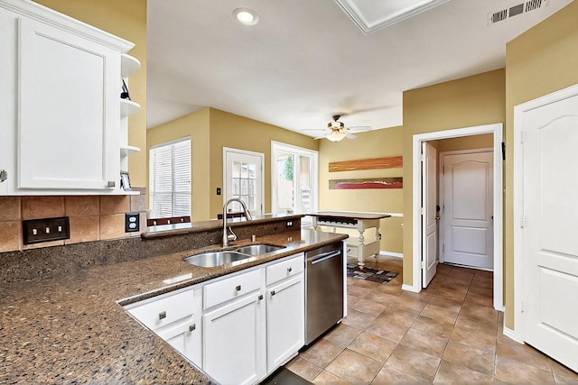 4533 Crooked Ridge Dr, The Colony, TX 75056 - kitchen with a sink, dishwasher, a peninsula, and white cabinetry