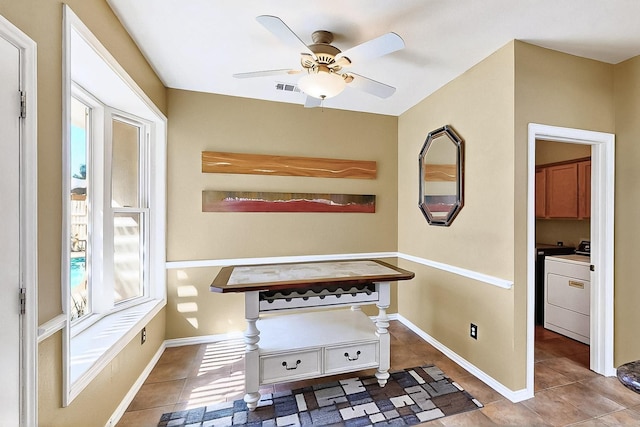 4533 Crooked Ridge Dr, The Colony, TX 75056 - hallway with washer / dryer, tile patterned floors, and baseboards