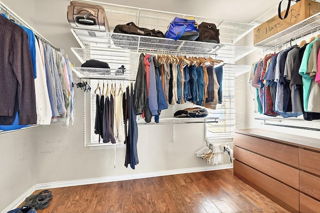 4533 Crooked Ridge Dr, The Colony, TX 75056 - walk in closet featuring wood finished floors