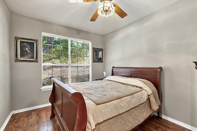 4533 Crooked Ridge Dr, The Colony, TX 75056 - bedroom with dark wood-style flooring, baseboards, and ceiling fan