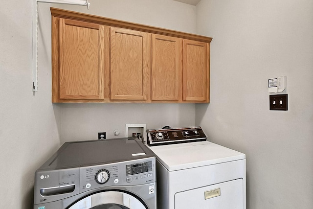 4533 Crooked Ridge Dr, The Colony, TX 75056 - washroom featuring cabinet space and washing machine and clothes dryer