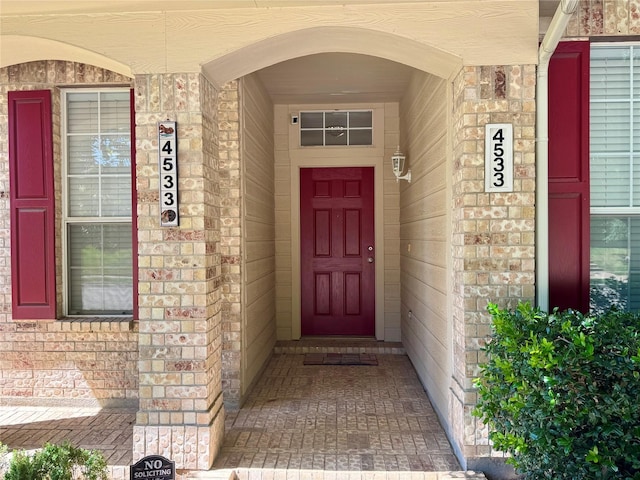 4533 Crooked Ridge Dr, The Colony, TX 75056 - view of exterior entry featuring covered porch and brick siding