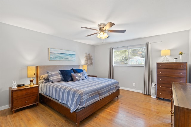 2708 Hunters Creek Dr, Plano, TX 75075 - bedroom featuring baseboards, light wood-type flooring, and ceiling fan