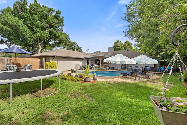 2708 Hunters Creek Dr, Plano, TX 75075 - view of yard featuring a patio area and a trampoline