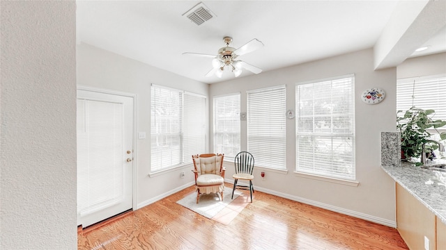 2700 Lake Crest Dr, Flower Mound, TX 75022 - living area featuring light wood-style floors, a ceiling fan, and baseboards