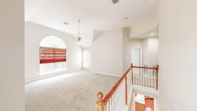 2700 Lake Crest Dr, Flower Mound, TX 75022 - carpeted spare room featuring vaulted ceiling, a ceiling fan, and baseboards