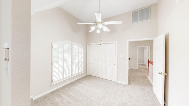 2700 Lake Crest Dr, Flower Mound, TX 75022 - unfurnished bedroom with high vaulted ceiling, carpet floors, ceiling fan, baseboards, and a closet
