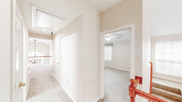 2700 Lake Crest Dr, Flower Mound, TX 75022 - corridor with attic access, carpet floors, a chandelier, and baseboards