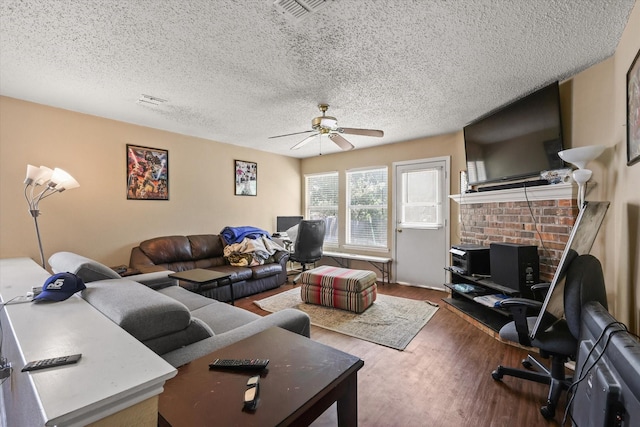 2200 Lookout Ln, Denton, TX 76207 - living area featuring ceiling fan, wood finished floors, and a textured ceiling