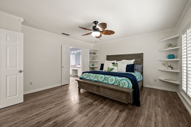 3428 Glade Creek Dr, Hurst, TX 76054 - bedroom with wood finished floors, crown molding, baseboards, a textured ceiling, and connected bathroom