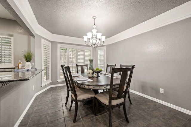3428 Glade Creek Dr, Hurst, TX 76054 - dining space featuring a chandelier, dark tile patterned flooring, a textured ceiling, baseboards, and a raised ceiling