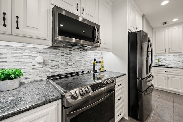3428 Glade Creek Dr, Hurst, TX 76054 - kitchen featuring appliances with stainless steel finishes, decorative backsplash, white cabinets, recessed lighting, and tile patterned flooring