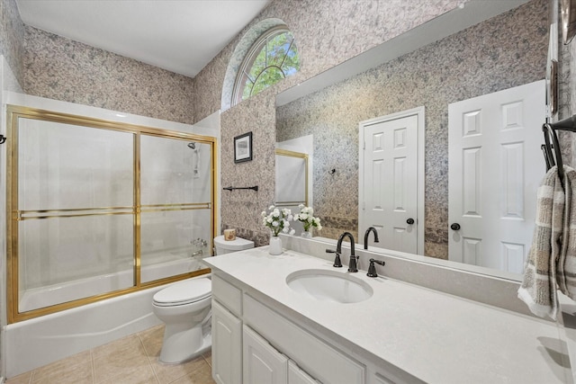 3134 Oak Dr, Rockwall, TX 75032 - full bathroom with tile patterned flooring, toilet, vanity, and shower / bath combination with glass door