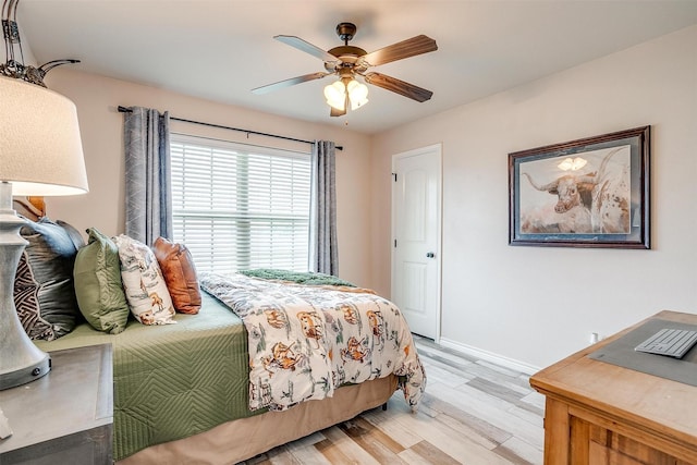 5633 Veal Station Rd, Weatherford, TX 76085 - bedroom featuring light wood-style floors, baseboards, and a ceiling fan