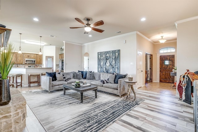 5633 Veal Station Rd, Weatherford, TX 76085 - living room featuring arched walkways, recessed lighting, a ceiling fan, and ornamental molding