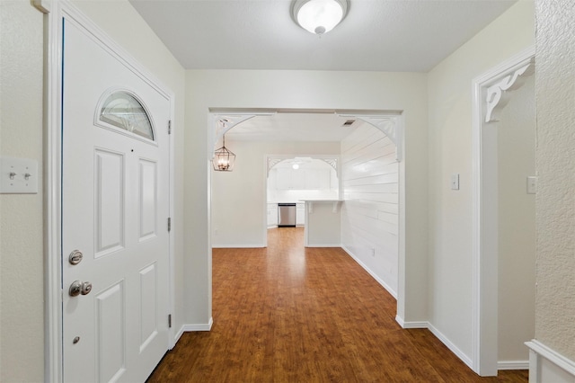 207 Johnston Blvd, Waxahachie, TX 75165 - entryway with dark wood-style flooring, arched walkways, and baseboards