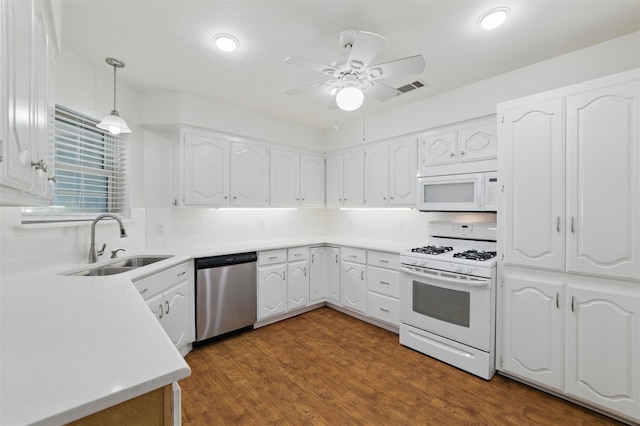 207 Johnston Blvd, Waxahachie, TX 75165 - kitchen with white appliances, a sink, ceiling fan, white cabinets, and decorative backsplash