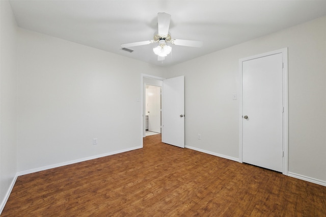 207 Johnston Blvd, Waxahachie, TX 75165 - unfurnished bedroom featuring wood finished floors, baseboards, and ceiling fan