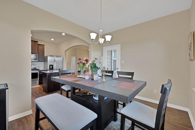 5201 Beaver Creek Ave, Denton, TX 76207 - dining area with arched walkways, a chandelier, dark wood-style flooring, baseboards, and recessed lighting