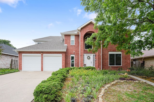2207 Villanova St, Arlington, TX 76018 - traditional-style home featuring an attached garage, a shingled roof, concrete driveway, and brick siding