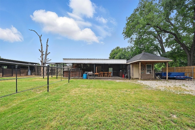 11514 Oakfield Dr, Balch Springs, TX 75180 - rear view of property with an outdoor structure and an exterior structure