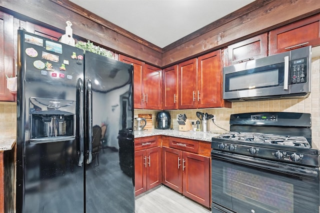 11514 Oakfield Dr, Balch Springs, TX 75180 - kitchen with black appliances, tasteful backsplash, light stone countertops, reddish brown cabinets, and light wood finished floors