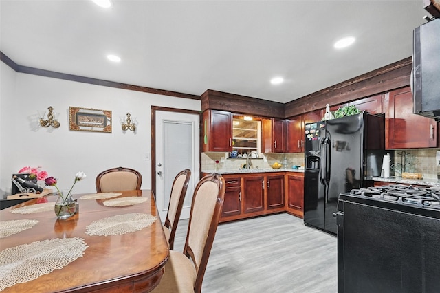 11514 Oakfield Dr, Balch Springs, TX 75180 - kitchen with gas range, tasteful backsplash, light wood-type flooring, ornamental molding, and recessed lighting