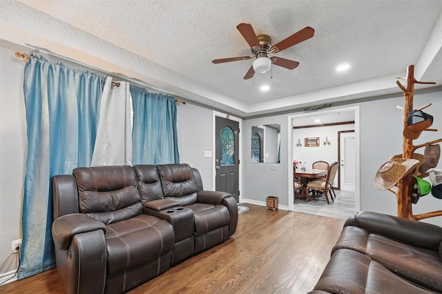 11514 Oakfield Dr, Balch Springs, TX 75180 - living area featuring ceiling fan, wood finished floors, a textured ceiling, baseboards, and recessed lighting