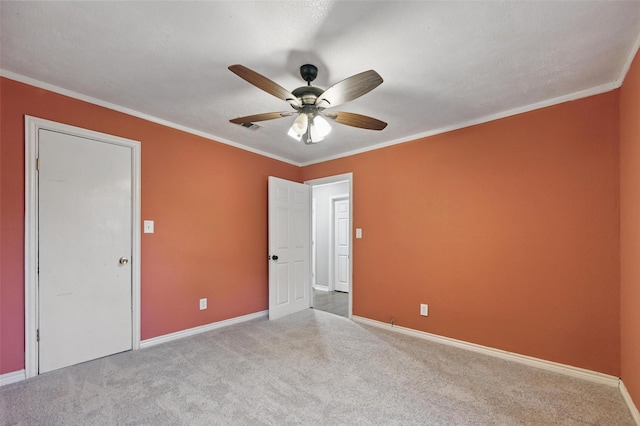 11514 Oakfield Dr, Balch Springs, TX 75180 - unfurnished bedroom featuring carpet floors, baseboards, crown molding, and ceiling fan