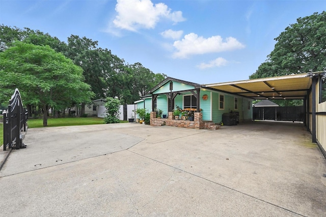 11514 Oakfield Dr, Balch Springs, TX 75180 - view of front of house with concrete driveway and an attached carport