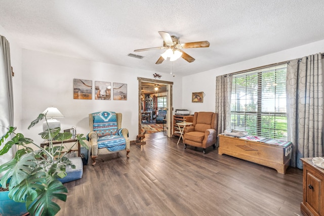 106 Hillcroft Dr, Weatherford, TX 76087 - sitting room featuring a textured ceiling, a ceiling fan, and wood finished floors