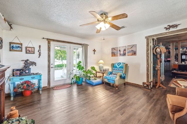 106 Hillcroft Dr, Weatherford, TX 76087 - living area with ceiling fan, a textured ceiling, wood finished floors, and baseboards