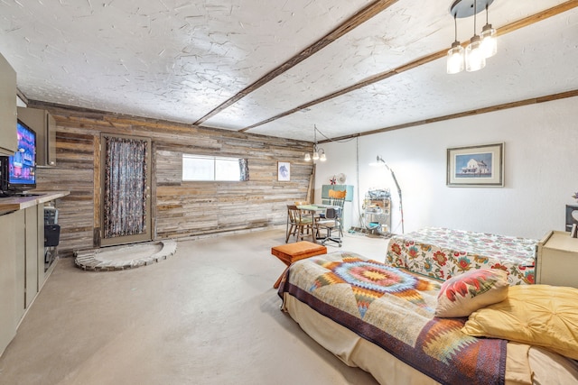 106 Hillcroft Dr, Weatherford, TX 76087 - living area featuring wooden walls, finished concrete flooring, and a textured ceiling