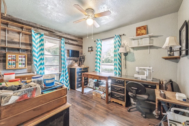 106 Hillcroft Dr, Weatherford, TX 76087 - office space with a textured ceiling, wooden walls, wood finished floors, a ceiling fan, and a textured wall