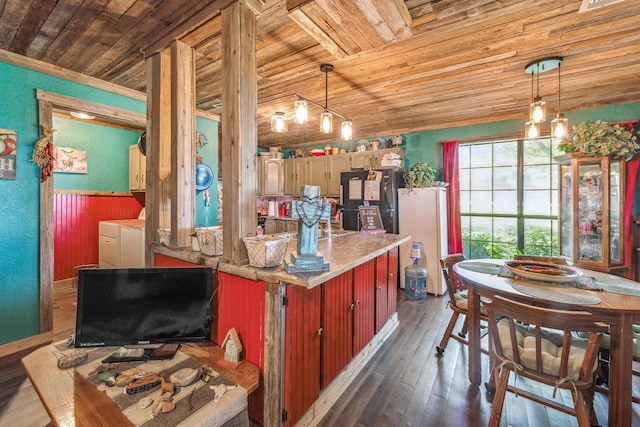106 Hillcroft Dr, Weatherford, TX 76087 - kitchen with wood ceiling, washer and dryer, freestanding refrigerator, dark wood-style floors, and light countertops