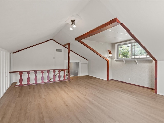 5217 Blue Valley Ct, Fort Worth, TX 76112 - additional living space with wood finished floors, vaulted ceiling, and baseboards