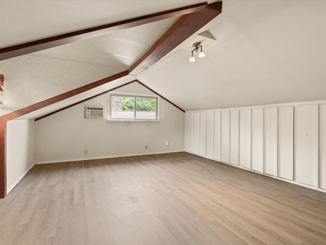 5217 Blue Valley Ct, Fort Worth, TX 76112 - bonus room with wood finished floors, a wall mounted air conditioner, and baseboards