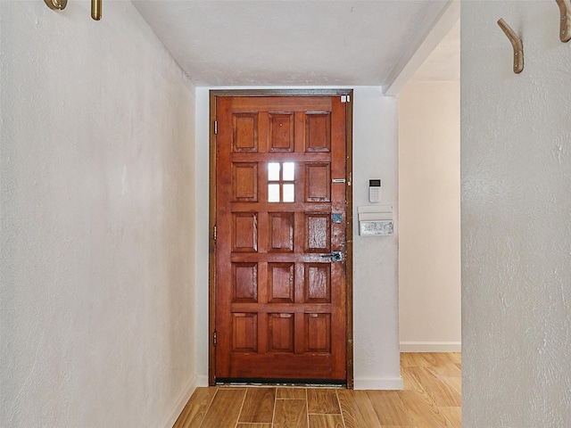 3146 Oak Hill Rd, Carrollton, TX 75007 - entrance foyer with wood finished floors and baseboards