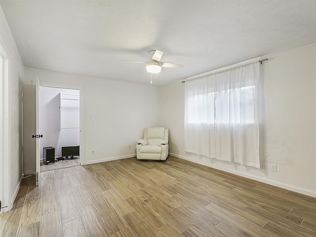 3146 Oak Hill Rd, Carrollton, TX 75007 - unfurnished room featuring light wood finished floors, ceiling fan, and baseboards