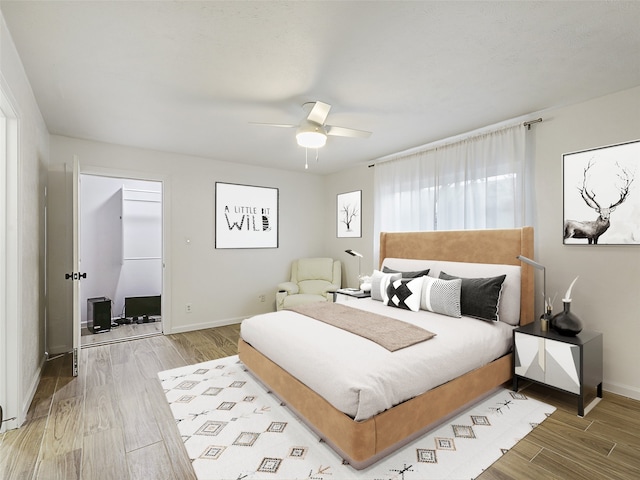 3146 Oak Hill Rd, Carrollton, TX 75007 - bedroom with wood finished floors, baseboards, and a ceiling fan