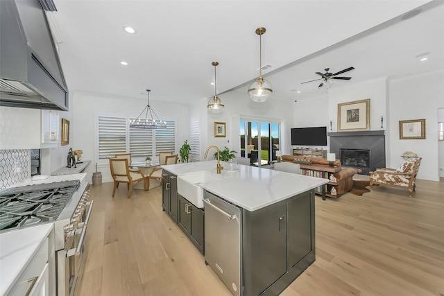 277 Schneider Rd, Sherman, TX 75090 - kitchen featuring wall chimney exhaust hood, a sink, stainless steel appliances, light wood finished floors, and ceiling fan
