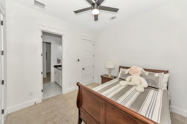 277 Schneider Rd, Sherman, TX 75090 - bedroom with light colored carpet, baseboards, ensuite bath, and a ceiling fan