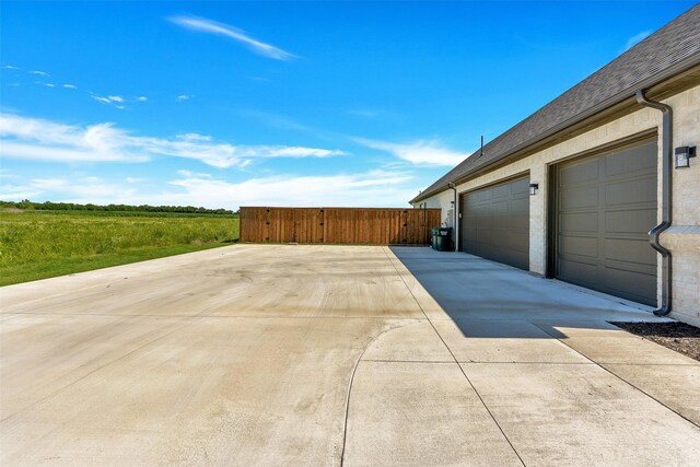 277 Schneider Rd, Sherman, TX 75090 - garage featuring driveway and a gate