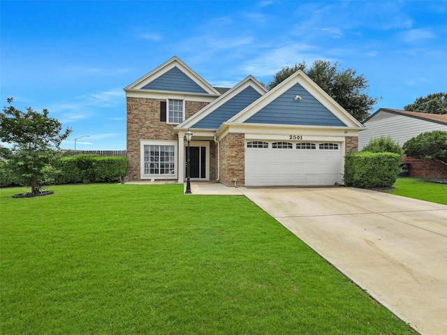 2501 Dahlia Dr, Fort Worth, TX 76123 - view of front of property with an attached garage, driveway, a front yard, and brick siding