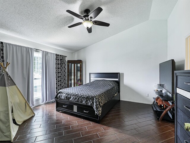 2501 Dahlia Dr, Fort Worth, TX 76123 - bedroom featuring lofted ceiling, wood tiled floors, a textured ceiling, and ceiling fan