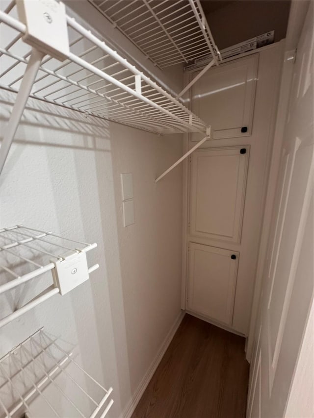 4800 W Lovers Ln Unit 212, Dallas, TX 75209 - walk in closet with dark wood-type flooring